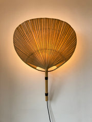 Uchiwa fan wall light designed in the 1970s by Ingo Maurer for his Munich based lighting design company, Design M.