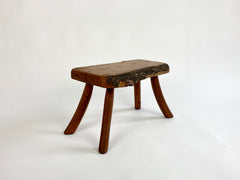Eyespy - Mid 20th century primitive stool / side table from the Netherlands with natural live bark edge top and gently curved legs. 