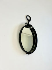 Brutalist mid-century oval wall mirror