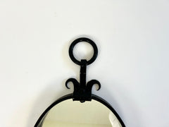 Brutalist mid-century oval wall mirror
