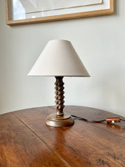 French midcentury table lamp In the style of Charles Dudouyt, c.1930-50

Oak facet carved stem on a turned wood base in a late deco style.