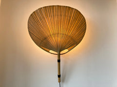 Uchiwa fan wall light designed in the 1970s by Ingo Maurer for his Munich based lighting design company, Design M.