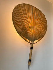 Uchiwa fan wall light designed in the 1970s by Ingo Maurer for his Munich based lighting design company, Design M.