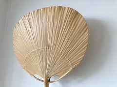 Uchiwa fan wall light designed in the 1970s by Ingo Maurer for his Munich based lighting design company, Design M.