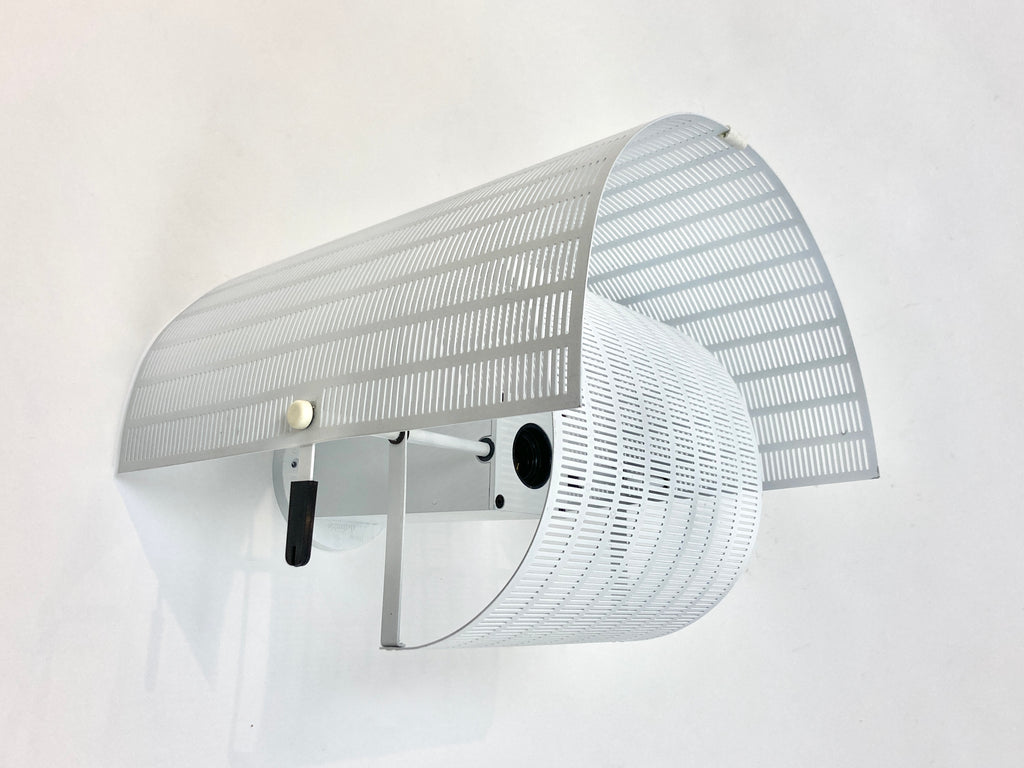 Wall light, model 'Shogun Parete' designed in 1986 by Swiss born architect and designer Mario Botta for Italian lighting company Artemide.   A large wall sconce with strong geometric forms, typical of Mario Botta's designs. The wall mounted version is no longer in production.