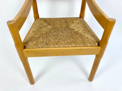 Carimate carver dining chair by Vico Magistretti
