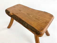 Eyespy - Mid 20th century primitive stool / side table from the Netherlands with natural live bark edge top and gently curved legs. 