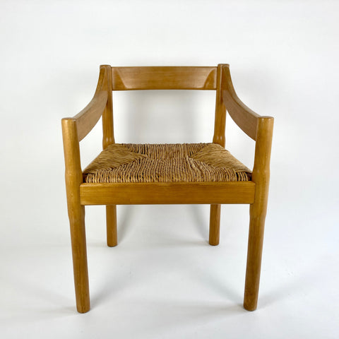 Carimate carver dining chairs by Vico Magistretti