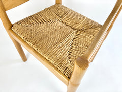 Carimate carver dining chairs by Vico Magistretti