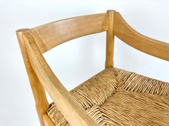 Carimate carver dining chairs by Vico Magistretti