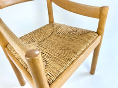 Carimate carver dining chairs by Vico Magistretti