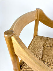 Carimate carver dining chairs by Vico Magistretti