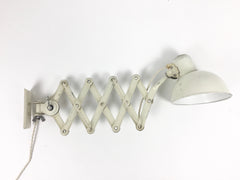 Pair of Kaiser Idell Model 6718 scissor arm wall mounted lamps - eyespy