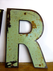 Vintage metal shop sign letters 'AMOUR' - eyespy