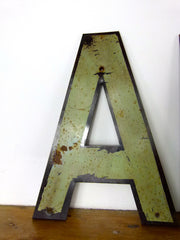 Vintage metal shop sign letters 'AMOUR' - eyespy