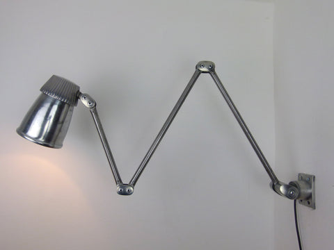 Vintage industrial wall mounted Lo-Vo-Lite lamp