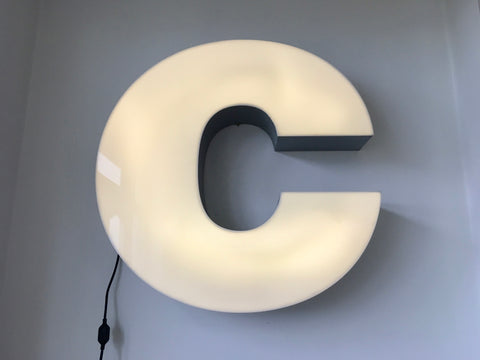 Giant reclaimed illuminated shop sign letter C